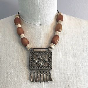 Vintage authentic African tribal necklace with metal center amber colored beads